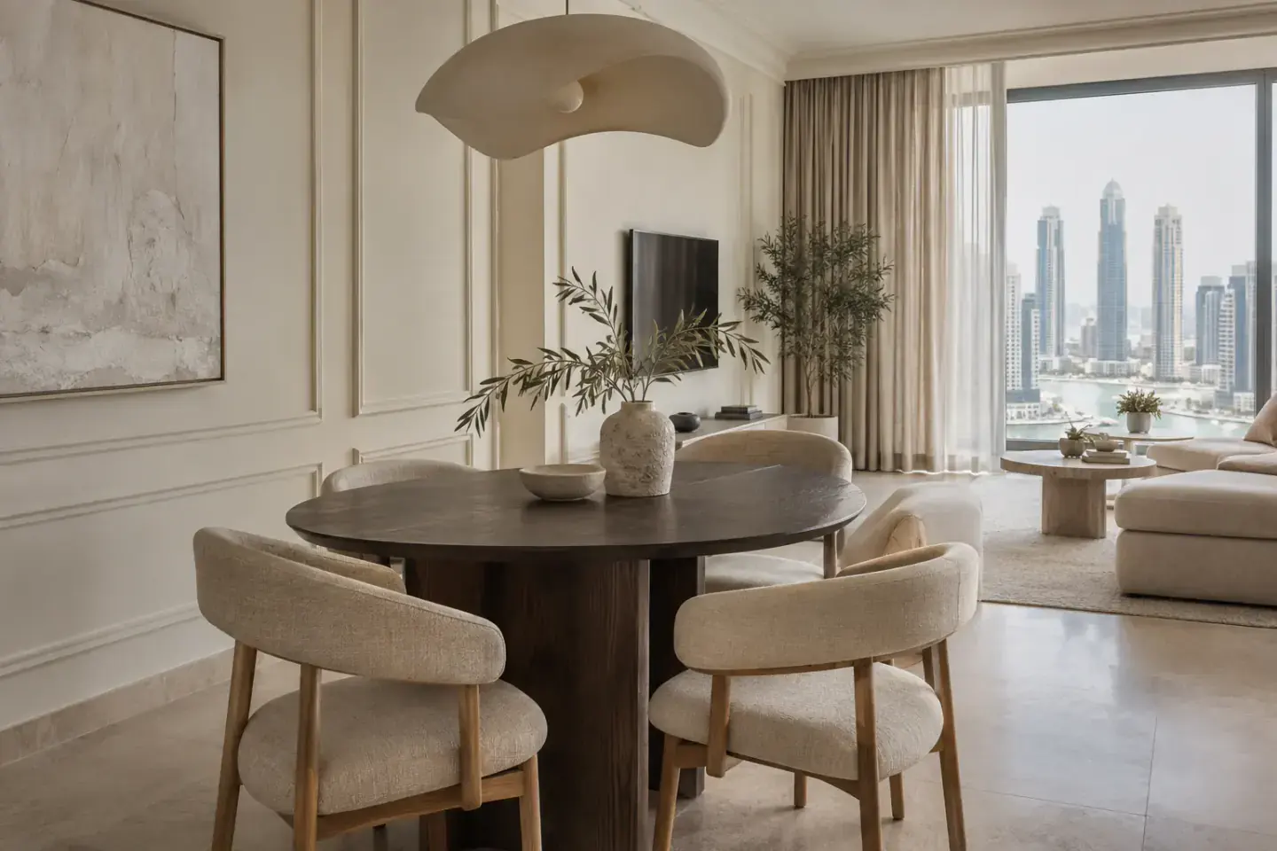 Warm apartment dining area with walnut table, oatmeal chairs and natural daylight