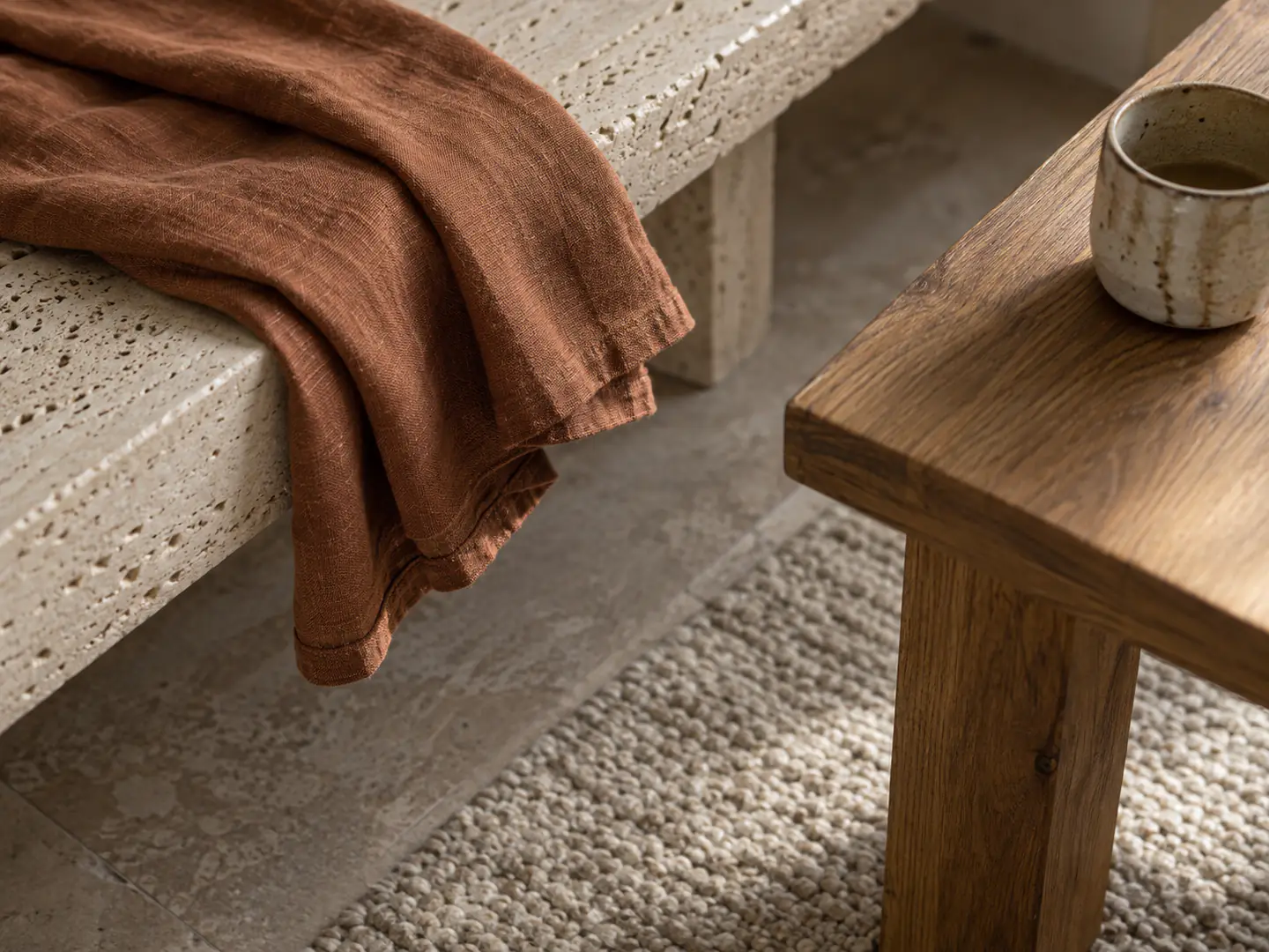 Linen, travertine, oak, ceramic and wool in close detail