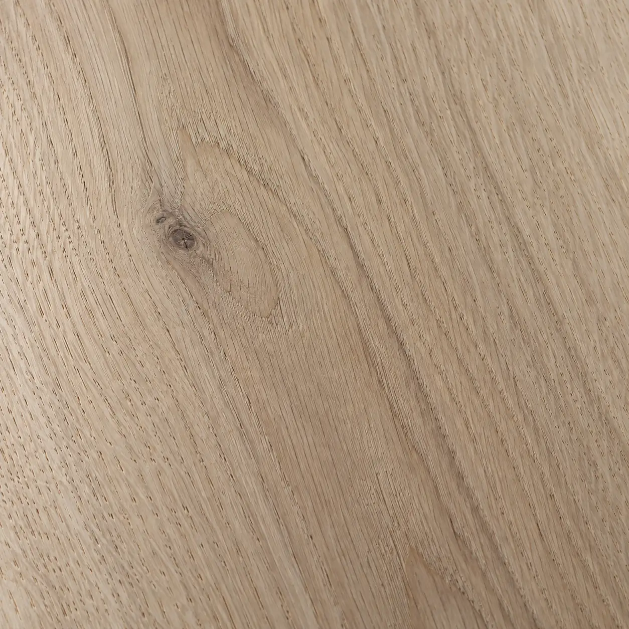 Close detail of pale oak, the grain running across the frame